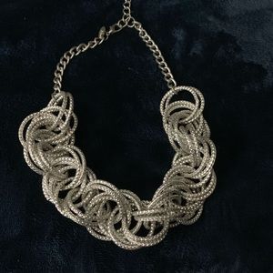 Gorgeous silver rings twined into a necklace